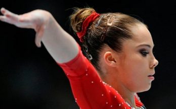 Image of an Olympic Gymnast Performing Against Cancer.