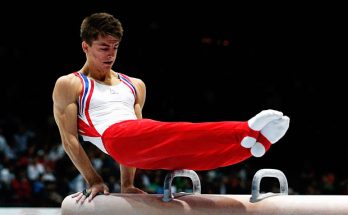 Male Gymnast doing pommal horse