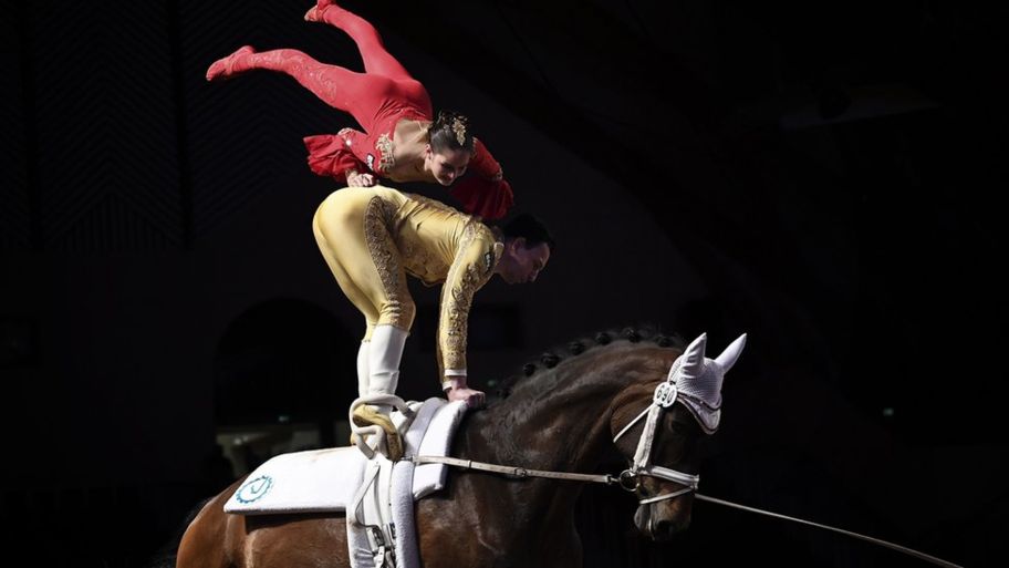 Two Gymnasts Performing Amanar Vault In A Gymnastic Show