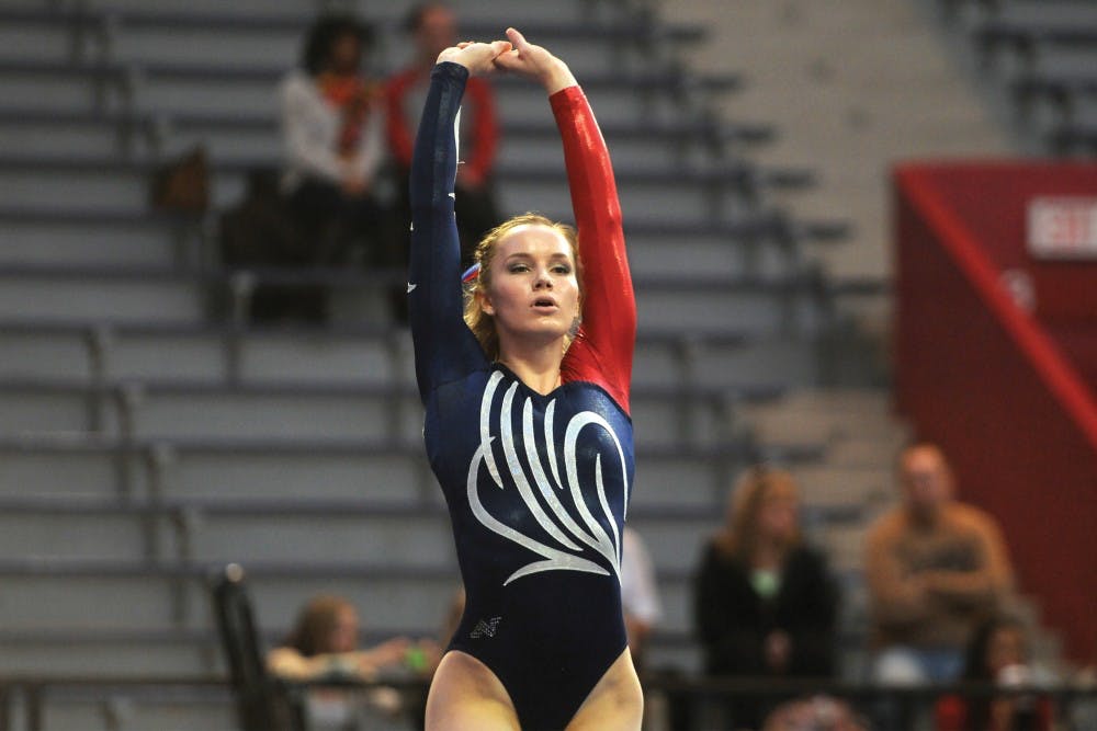 A woman gymnast makes an action